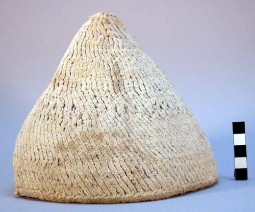 Pointed woven cotton cap; spiral ribbed surface; natural color