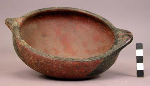 Small pottery dish - black and white on red