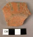 Small fragment of pottery base - black on red (Wace & Thompson, 1912, Types B3#2