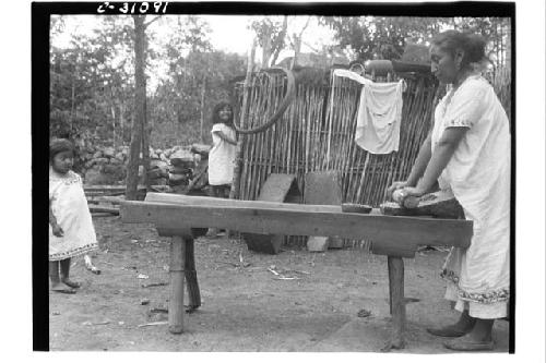 Corn grinding - Bernadino Tun's wife.