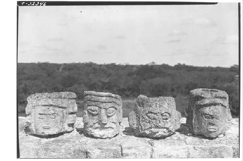 Caracol. 4 incensarios on parapet, upper platfrom, numbered from left to right 4