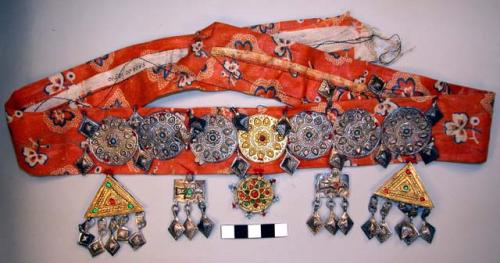 Headband of red cloth ornamented with silver alloy (palti)