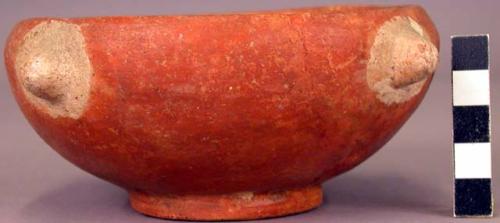 Red pottery bowl with white lugs