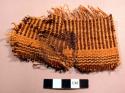 Woven fabric fragment, dark brown & orange dye, worn