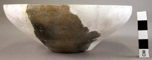 Ceramic bowl reconstructed from 2 mended, sherds, brown, incurving rim