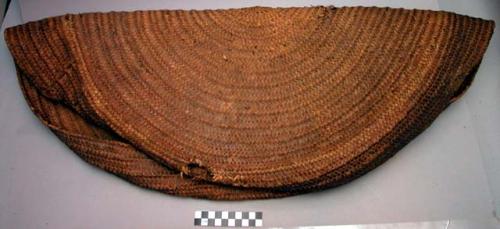 Cover of basket, this has been used under mortar for catching meal etc.
