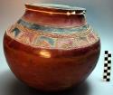 Red pottery vessel with incised  and black designs. Nsuku