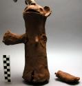 Male clay figure, made of unfired clay, with extended arms