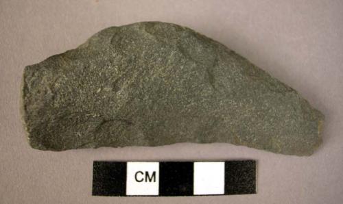 Chipped, unsmoothed basalt sickle? blade