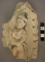 Plaster plaque with upper part of dancing figure in relief