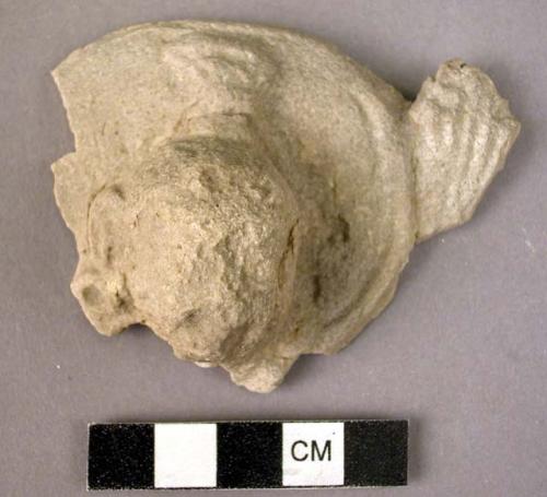 Small plaster buddha head with part of nimbus