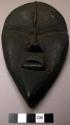 Small wooden mask.  "Si Gbi Glü."  Guard of "Kaso".