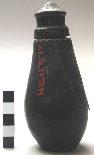 Bunga's wooden powder horn covered with pig's bladder