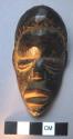 Small wooden mask,"Mã."