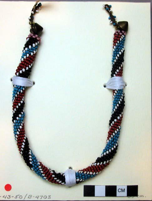 Beaded necklace, cylindrical - over leather pink, white, blue, red, black beads