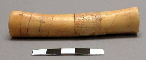 Paper bag containing 8 smoking pipes: (a-e) 5 of bone, all with incised black li