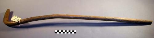 Walking stick of fir wood. Handle carved to represent the head of a crane.