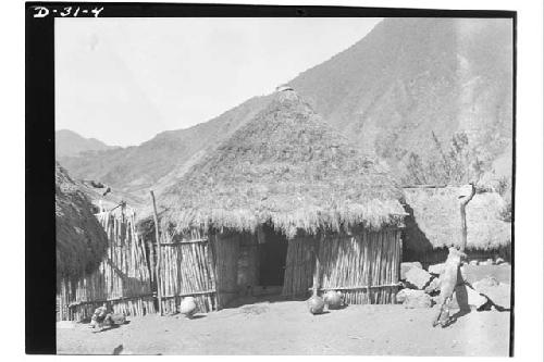 Stone house with small rooms of cane added in front