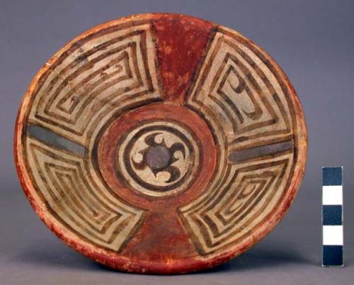 Polychrome pottery plate, annular base