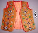 Crow buckskin vest w/ trade cloth lining & back. Floral beadwork & red trim