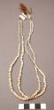 Crow necklace. Consists of 2 strands of old white beads of varying size.