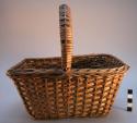 Basket, woven cane, rectangular body, handle across rim