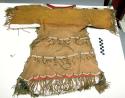 Sioux child's dress. Made from buckskin fringed along sides and at bottom