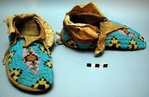 One pair of moccasins--skin; top beaded