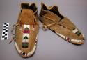 Pair of men's moccasins with beaded trim border