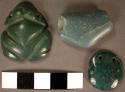 Irregular jade bead--tubular but with a jut on one side