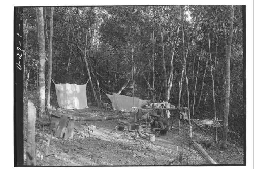 Man warming tortillas in camp