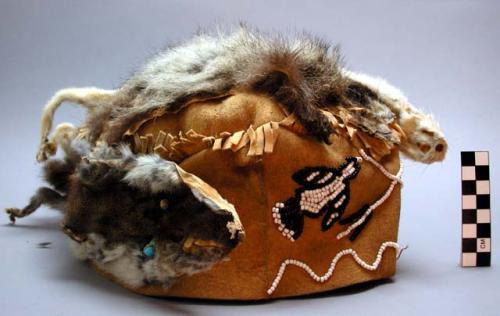 Flat topped cap. Buckskin crown covered with marmot fur.