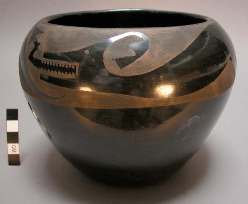 Black-on-black jar with avanyu design