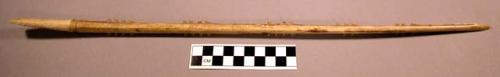 Bone implement, carved, denticulated