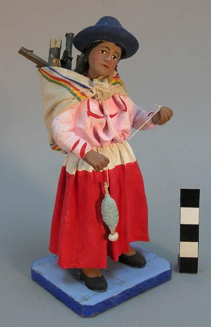 Figure of woman spinning