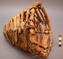 Wrapped weave basketry cap.