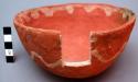 Red painted pottery bowl, badly over fired