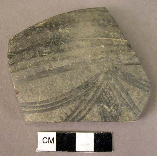 Sherd of shouldered pottery bowl with fluted decoration