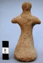 Unfired clay figurine depicting human