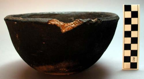 Black clay pot for cooking, made by the women