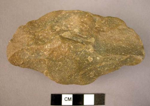 Keeled ovate quartzite hand axe, both surfaces have high ridge; wavy edge around