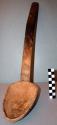 Wooden spoon. 50x7.5x10 cm., used as a communal eating spoon.