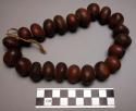 Ceremonial necklace of brown nuts