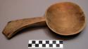 Wooden spoon for removing food from pot. Chikowe