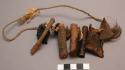 Wooden hunting whistles and charms on string