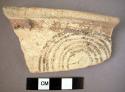 Philistine ware crater bowl rim , with pink spiral on white