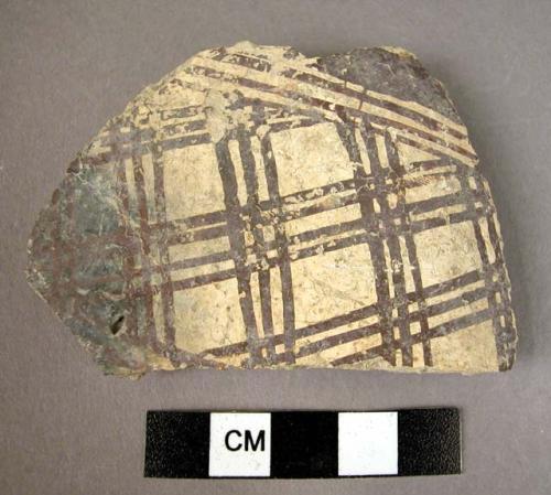 Gray slip potsherd with dark brown cross-hatch decoration