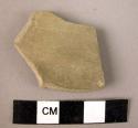 Body sherd, ext. brownish grey int. and core grey, fine paste, ext. polished, in