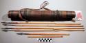 Quiver, skin covered wood tube, pigmented, with 5 metal tip arrows, 1 shaft
