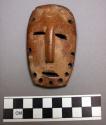 Wooden mask - light brown patine (3.75" high)